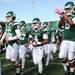 Eastern Michigan football players take the field before the start of their game against Western Michigan at Rynearson Stadium on Saturday afternoon. Melanie Maxwell I AnnArbor.com